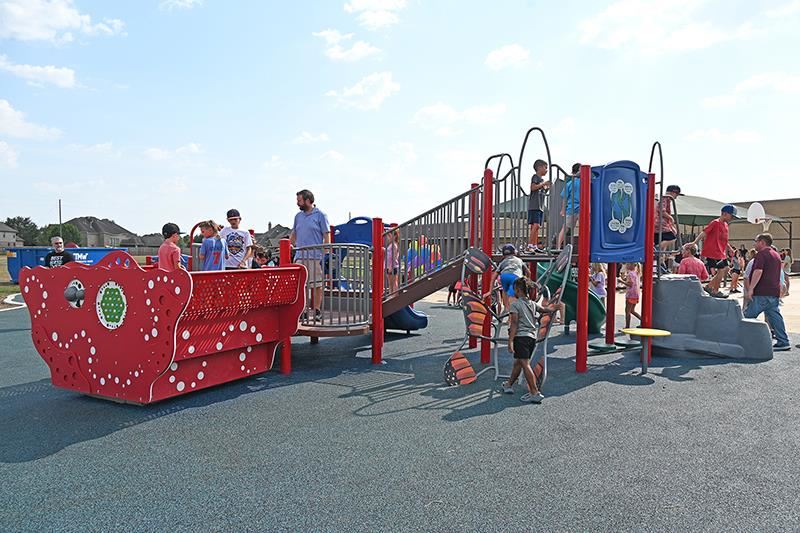 Swenke Elementary School’s new all-inclusive playground includes a soft cushion rubberized surface.